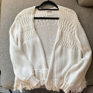 Frame cardigan knit sweater with fringe bottom